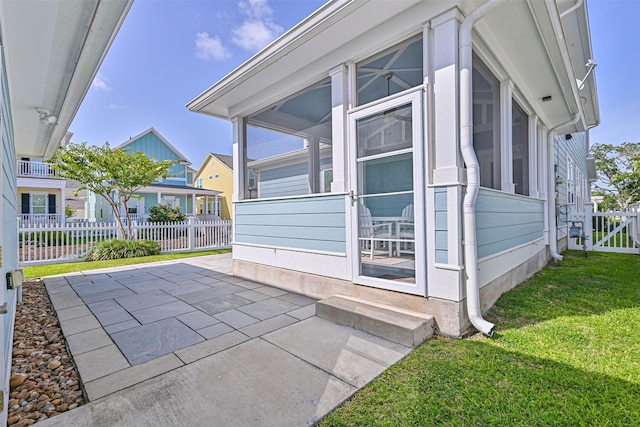 6 Caravelle Ct, Galveston, TX 77554 - view of property exterior with a sunroom and a patio area