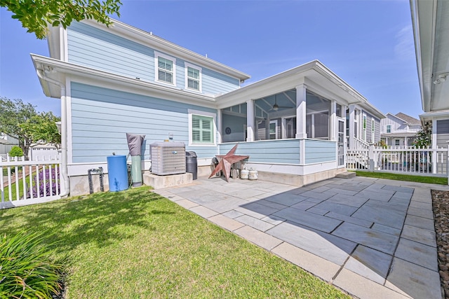 6 Caravelle Ct, Galveston, TX 77554 - back of property with a sunroom, a patio, and ceiling fan