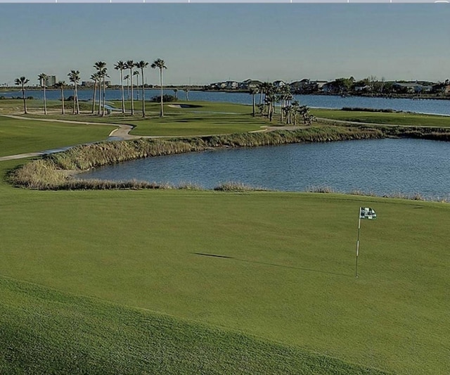 6 Caravelle Ct, Galveston, TX 77554 - view of community with a water view, view of golf course, and a lawn