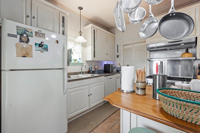 1611 34th St, Galveston, TX 77550 - kitchen featuring white appliances, ventilation hood, pendant lighting, light tile patterned flooring, and glass insert cabinets