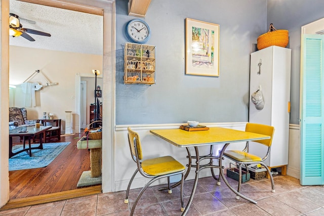 1611 34th St, Galveston, TX 77550 - dining area with a ceiling fan, tile patterned flooring, and a textured ceiling