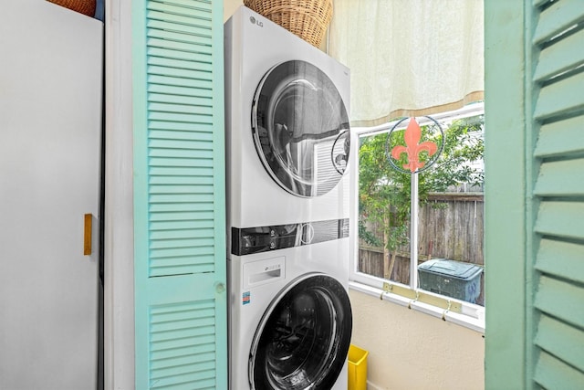 1611 34th St, Galveston, TX 77550 - laundry area featuring estacked washer and dryer and plenty of natural light