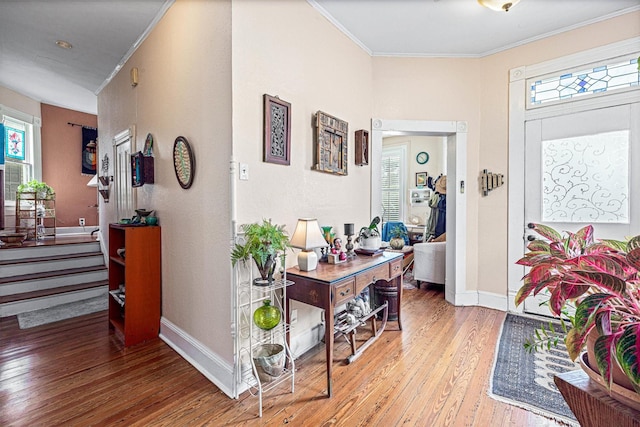 1611 34th St, Galveston, TX 77550 - entryway with light wood finished floors and crown molding