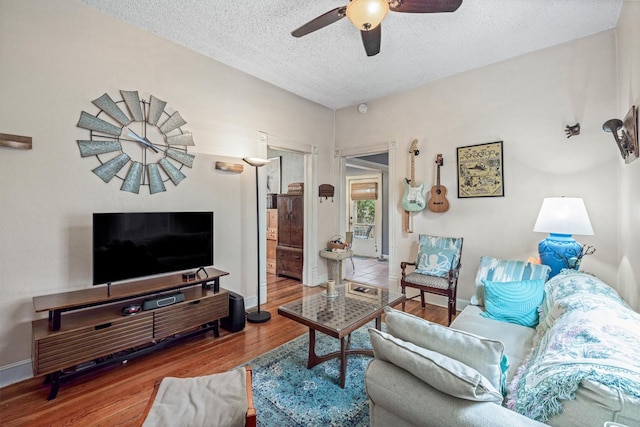 1611 34th St, Galveston, TX 77550 - living room with ceiling fan, wood finished floors, and a textured ceiling