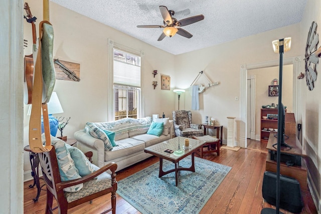 1611 34th St, Galveston, TX 77550 - living area with a textured ceiling, a ceiling fan, and wood-type flooring