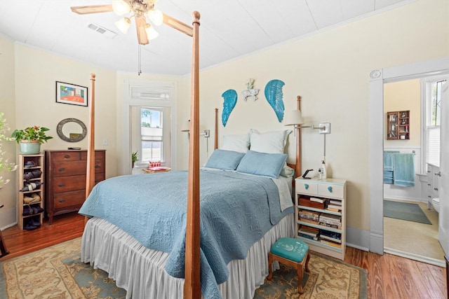 1611 34th St, Galveston, TX 77550 - bedroom featuring wood finished floors, crown molding, and a ceiling fan