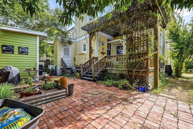 1611 34th St, Galveston, TX 77550 - view of patio / terrace featuring a deck and grilling area