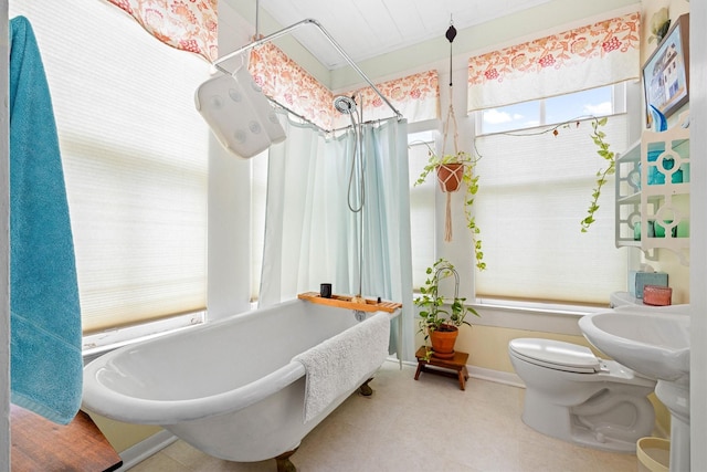 1611 34th St, Galveston, TX 77550 - bathroom with a soaking tub and a shower with curtain