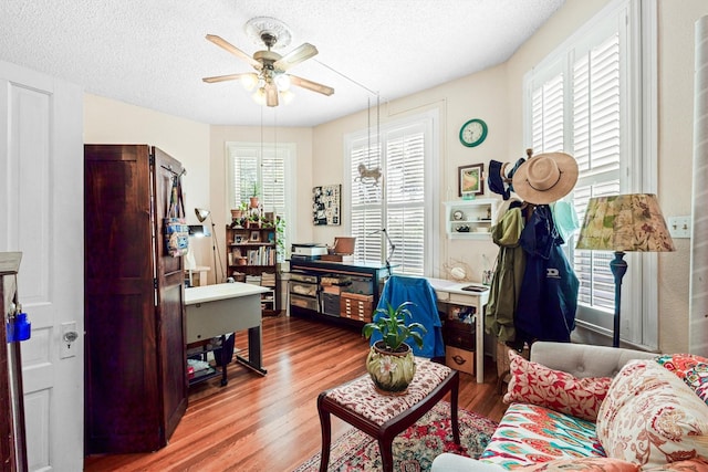 1611 34th St, Galveston, TX 77550 - office space with ceiling fan, wood finished floors, and a textured ceiling