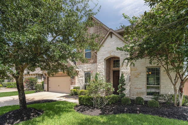 20102 Three Chutes Ln, Cypress, TX 77433 - french country inspired facade with stone siding and concrete driveway