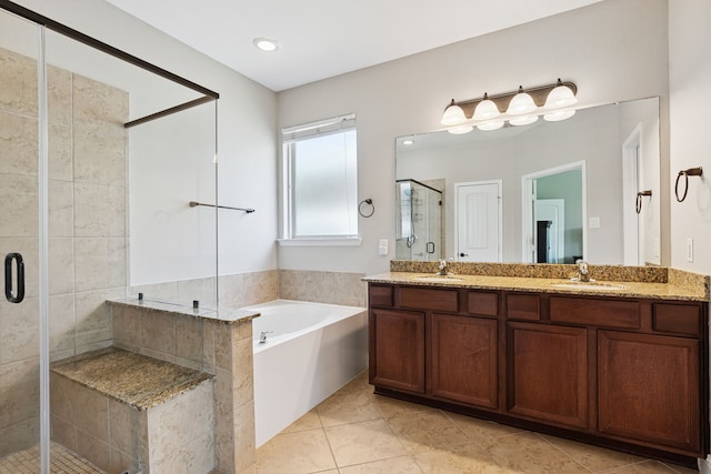 20102 Three Chutes Ln, Cypress, TX 77433 - bathroom with a shower stall, double vanity, a garden tub, and tile patterned floors