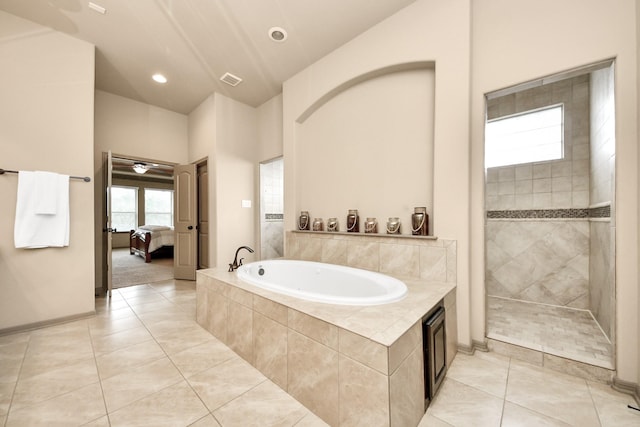 13810 Lake Prt, Cypress, TX 77429 - bathroom featuring a bath, tile patterned floors, ensuite bathroom, and tiled shower