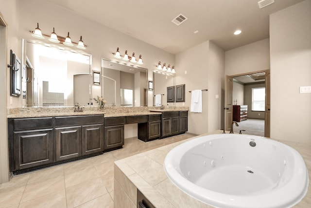 13810 Lake Prt, Cypress, TX 77429 - bathroom featuring double vanity, a whirlpool tub, tile patterned floors, and recessed lighting