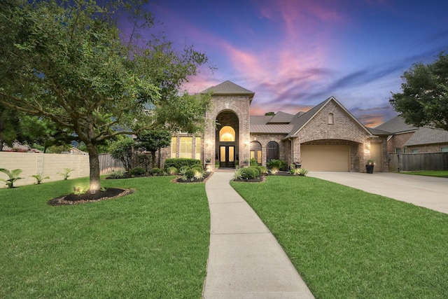 13810 Lake Prt, Cypress, TX 77429 - view of front of property featuring driveway, brick siding, an attached garage, and french doors