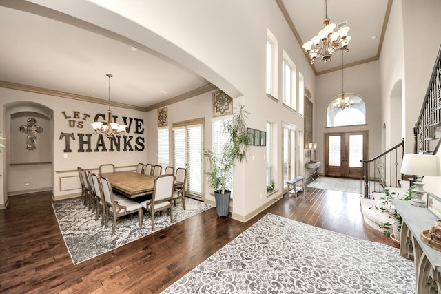 13810 Lake Prt, Cypress, TX 77429 - dining room featuring a chandelier, arched walkways, dark wood finished floors, ornamental molding, and stairway