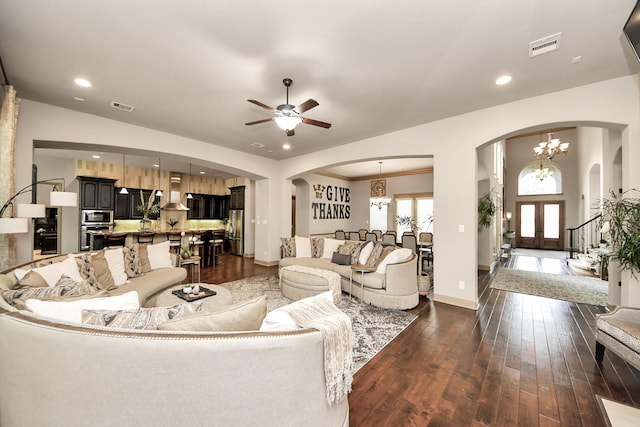 13810 Lake Prt, Cypress, TX 77429 - living room featuring arched walkways, a chandelier, ceiling fan, dark wood-style flooring, and recessed lighting
