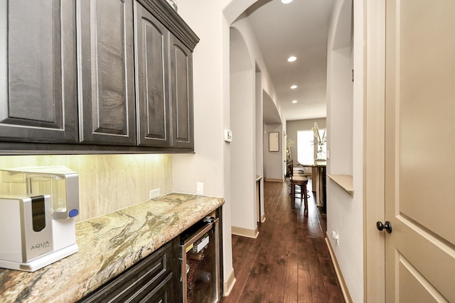 13810 Lake Prt, Cypress, TX 77429 - bar with wine cooler, backsplash, arched walkways, recessed lighting, and dark wood-style flooring