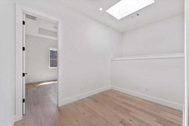 3914 Tulane St, Houston, TX 77018 - spare room with a skylight, light wood-style floors, and recessed lighting