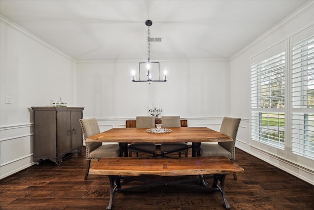 4107 Wentworth Dr, Fulshear, TX 77441 - dining room featuring wood finished floors, ornamental molding, a chandelier, and a decorative wall