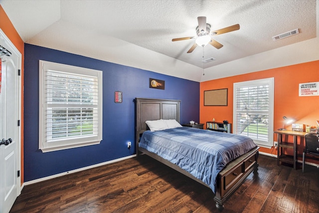 4107 Wentworth Dr, Fulshear, TX 77441 - bedroom with wood finished floors, vaulted ceiling, a textured ceiling, and a ceiling fan