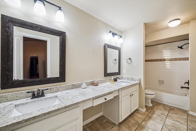 4107 Wentworth Dr, Fulshear, TX 77441 - bathroom featuring double vanity, tile patterned floors, a textured ceiling, and shower / bathtub combination