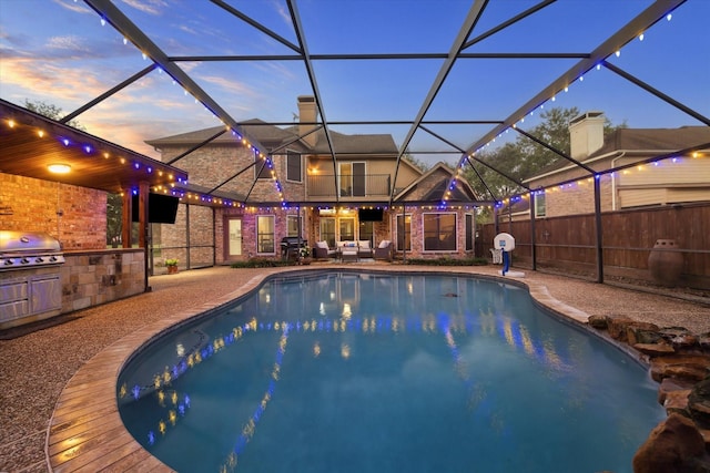 4107 Wentworth Dr, Fulshear, TX 77441 - view of pool with an outdoor kitchen, a patio area, glass enclosure, and an outdoor living space