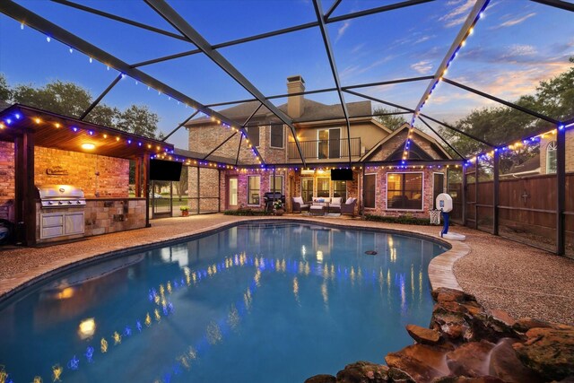 4107 Wentworth Dr, Fulshear, TX 77441 - outdoor pool featuring an outdoor kitchen, a patio area, a lanai, and an outdoor hangout area