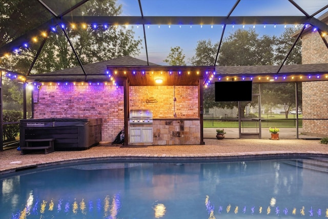 4107 Wentworth Dr, Fulshear, TX 77441 - outdoor pool featuring an outdoor kitchen, a hot tub, glass enclosure, and a patio