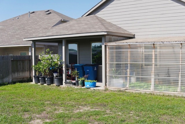 20367 Tembec Dr, New Caney, TX 77357 - rear view of house featuring roof with shingles
