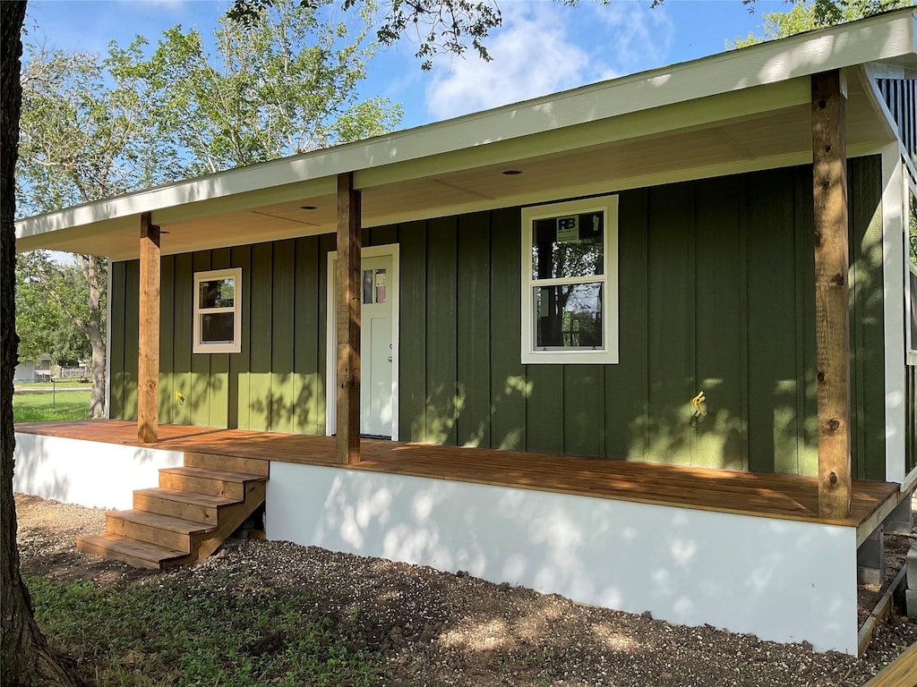 808 Josephine St, Yoakum, TX 77995 - view of side of property featuring covered porch and board and batten siding