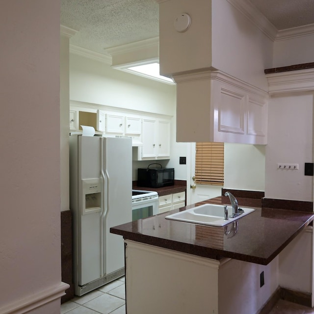 3600 Jeanetta St Unit 1301, Houston, TX 77063 - kitchen with a peninsula, white appliances, dark countertops, crown molding, and white cabinetry
