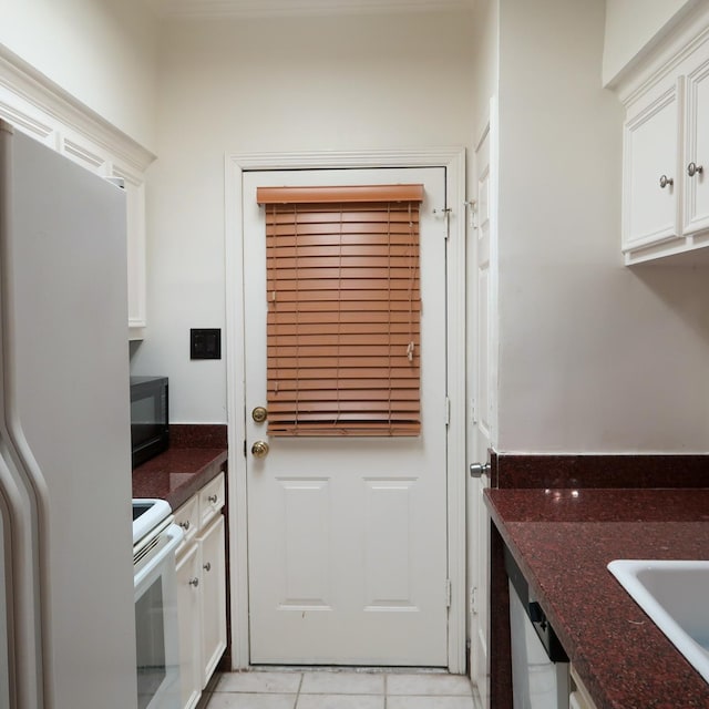 3600 Jeanetta St Unit 1301, Houston, TX 77063 - doorway to outside featuring light tile patterned floors and a sink