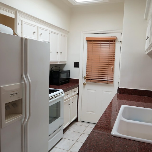 3600 Jeanetta St Unit 1301, Houston, TX 77063 - kitchen featuring white appliances, white cabinetry, and light tile patterned floors