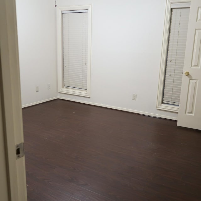 3600 Jeanetta St Unit 1301, Houston, TX 77063 - unfurnished bedroom featuring dark wood finished floors and baseboards