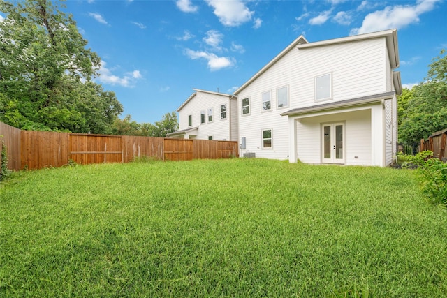 6715 England St, Houston, TX 77021 - back of house with french doors and a fenced backyard