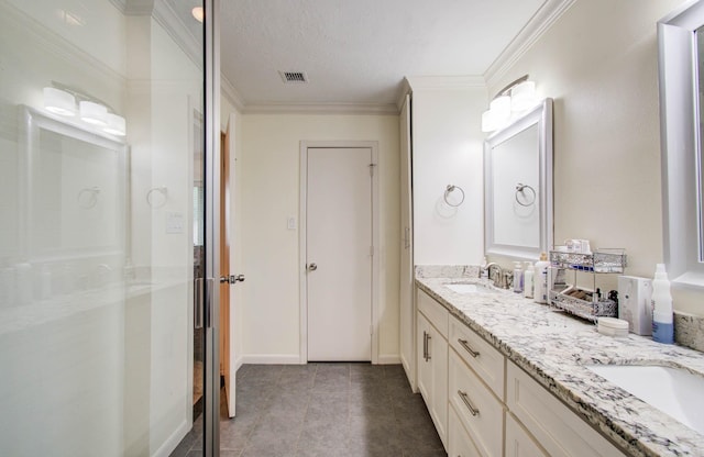 9818 Emnora Ln, Houston, TX 77080 - bathroom featuring double vanity, ornamental molding, and a shower with shower door