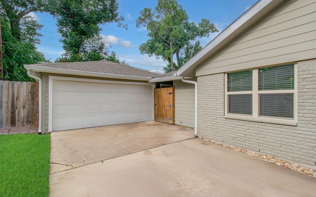 9818 Emnora Ln, Houston, TX 77080 - view of front of home featuring concrete driveway and brick siding