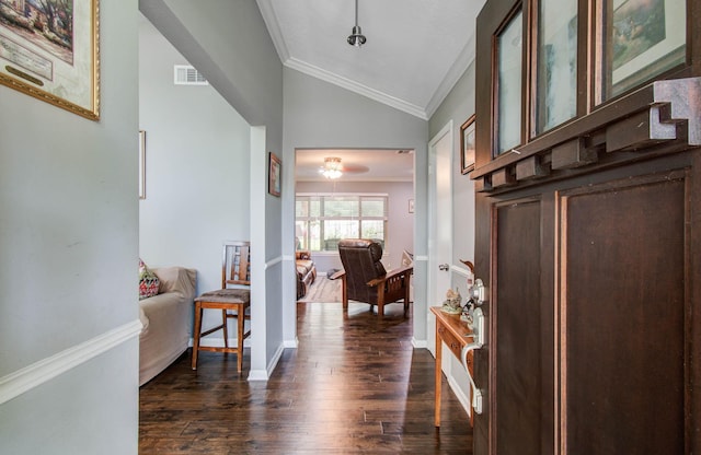 9818 Emnora Ln, Houston, TX 77080 - foyer entrance featuring ornamental molding, dark wood-style floors, and vaulted ceiling