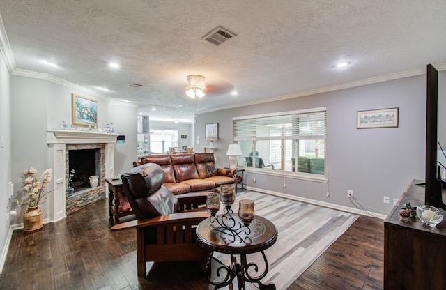 9818 Emnora Ln, Houston, TX 77080 - living room with wood-type flooring, recessed lighting, ornamental molding, a fireplace, and a textured ceiling