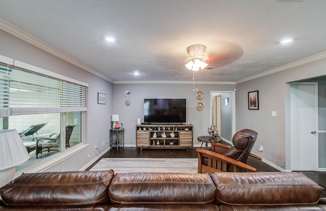 9818 Emnora Ln, Houston, TX 77080 - living room with wood finished floors, a ceiling fan, crown molding, and recessed lighting
