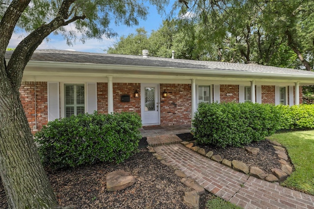 3815 Latma Dr, Houston, TX 77025 - ranch-style house with brick siding, covered porch, and roof with shingles