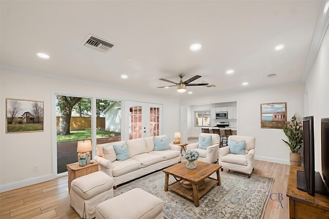 3815 Latma Dr, Houston, TX 77025 - living area with crown molding, light wood-type flooring, recessed lighting, ceiling fan, and french doors