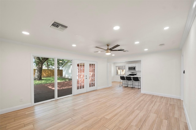3815 Latma Dr, Houston, TX 77025 - unfurnished living room featuring french doors, crown molding, light wood finished floors, ceiling fan, and recessed lighting