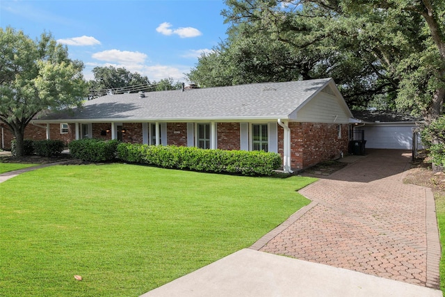 3815 Latma Dr, Houston, TX 77025 - ranch-style house featuring brick siding, a garage, decorative driveway, a shingled roof, and a front lawn