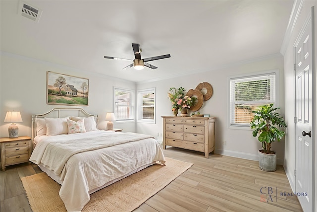 3815 Latma Dr, Houston, TX 77025 - bedroom with ornamental molding, multiple windows, light wood-style floors, and ceiling fan