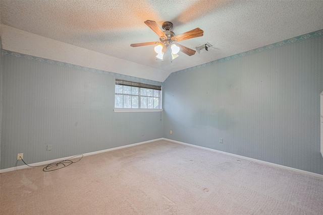 2823 W Pebble Beach Dr, Missouri City, TX 77459 - spare room with carpet flooring, a ceiling fan, and vaulted ceiling