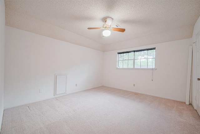 2823 W Pebble Beach Dr, Missouri City, TX 77459 - spare room featuring light carpet, ceiling fan, and a textured ceiling