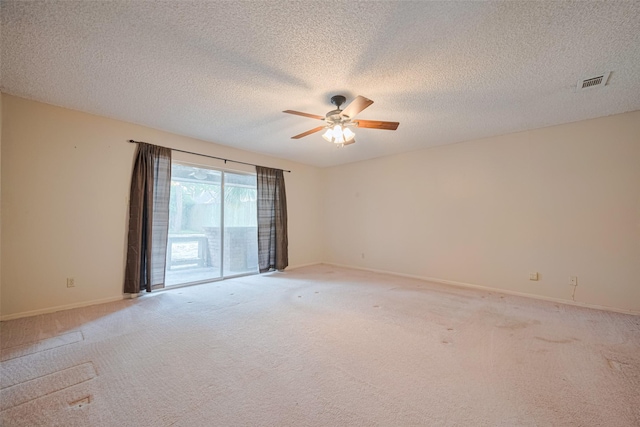 2823 W Pebble Beach Dr, Missouri City, TX 77459 - spare room featuring a ceiling fan, light colored carpet, and a textured ceiling