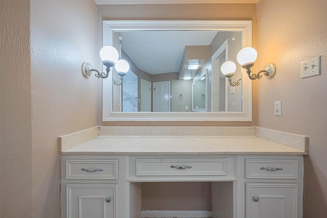2823 W Pebble Beach Dr, Missouri City, TX 77459 - bathroom with vanity and a textured wall