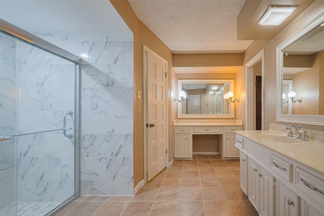 2823 W Pebble Beach Dr, Missouri City, TX 77459 - bathroom with a shower stall, vanity, a textured ceiling, and tile patterned floors